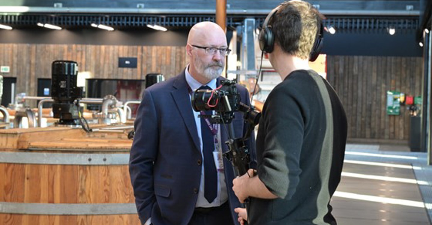 Principal K Enny Macinnes Is Interviewed At The Signing