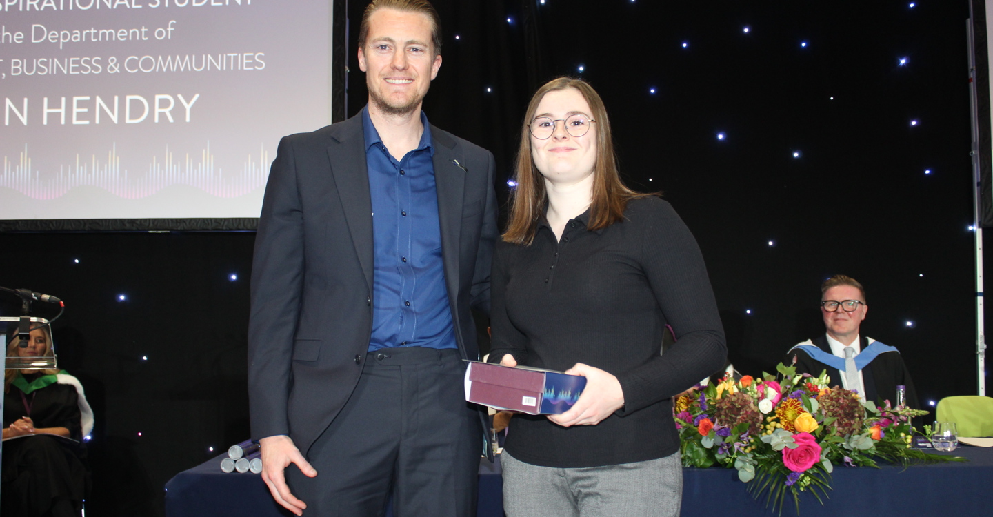 Erin Receives Award From Jamie Swinney