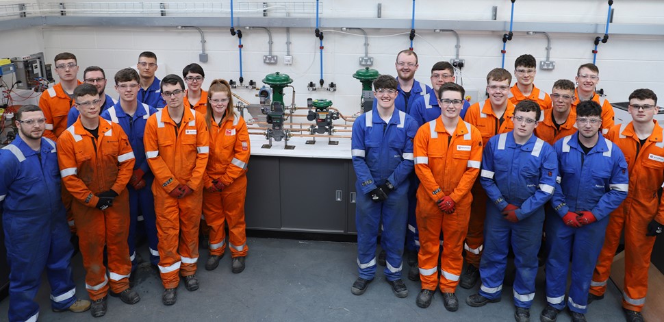 Apprentices help to fit out new engineering workshop