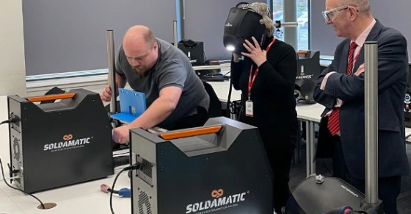 Regional Skills Hub Funding ECITB Chair Lynda Armstrong And CEO Andrew Hockey Using Simulator Equipment On A Site Tour Of Forth Valley College. (2)
